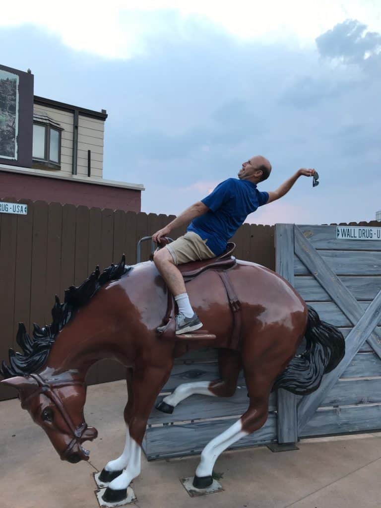 I ride a faux-bronco at Wall Drugs.