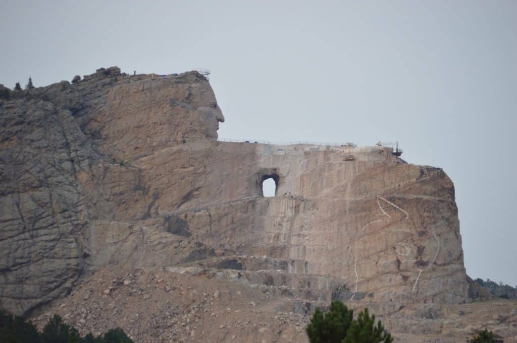 Crazy's Horse's profile gradually emerges from the mountain at Crazy Horse Memorial.