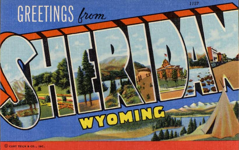 A historic postcard says "Greetings from Sheridan Wyoming"