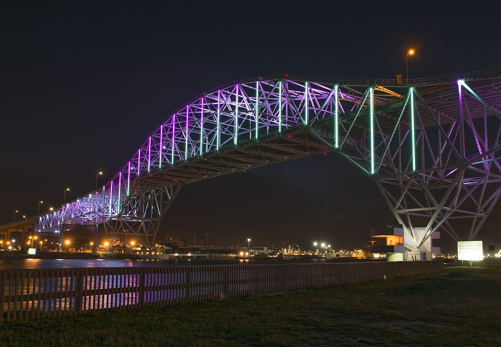 Purple lights illuminate the Corpus Christi Bridge.