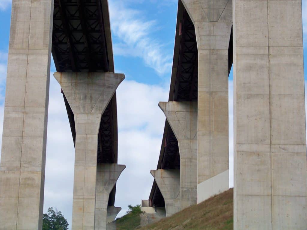 Concrete pillars of the Mingo Creek Viaduct tower sky high. The Mingo Creek Viaduct is one of the highest bridges in the US. 