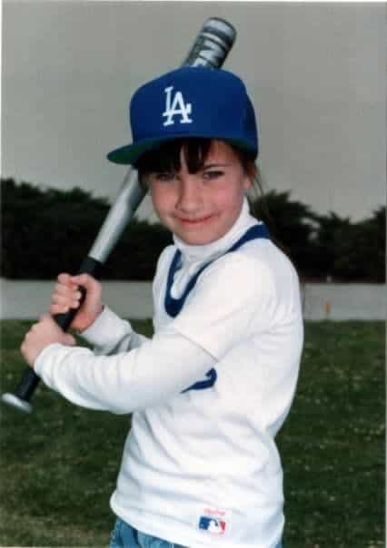 Girl in baseball uniform