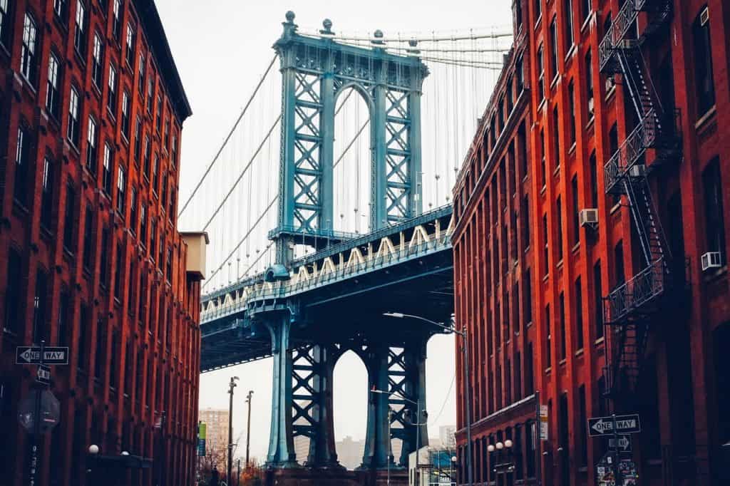 The Manhattan Bridge stands framed by historic New York building. Manhattan Bridge is one of the 89 highest bridges in the US.