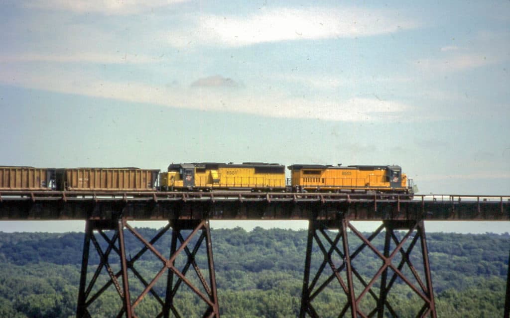 A train chugs across the top of the Union Pacific Kate Shelley Bridge. The Union Pacific Kate Shelley Bridge is one of the highest bridges in the US.