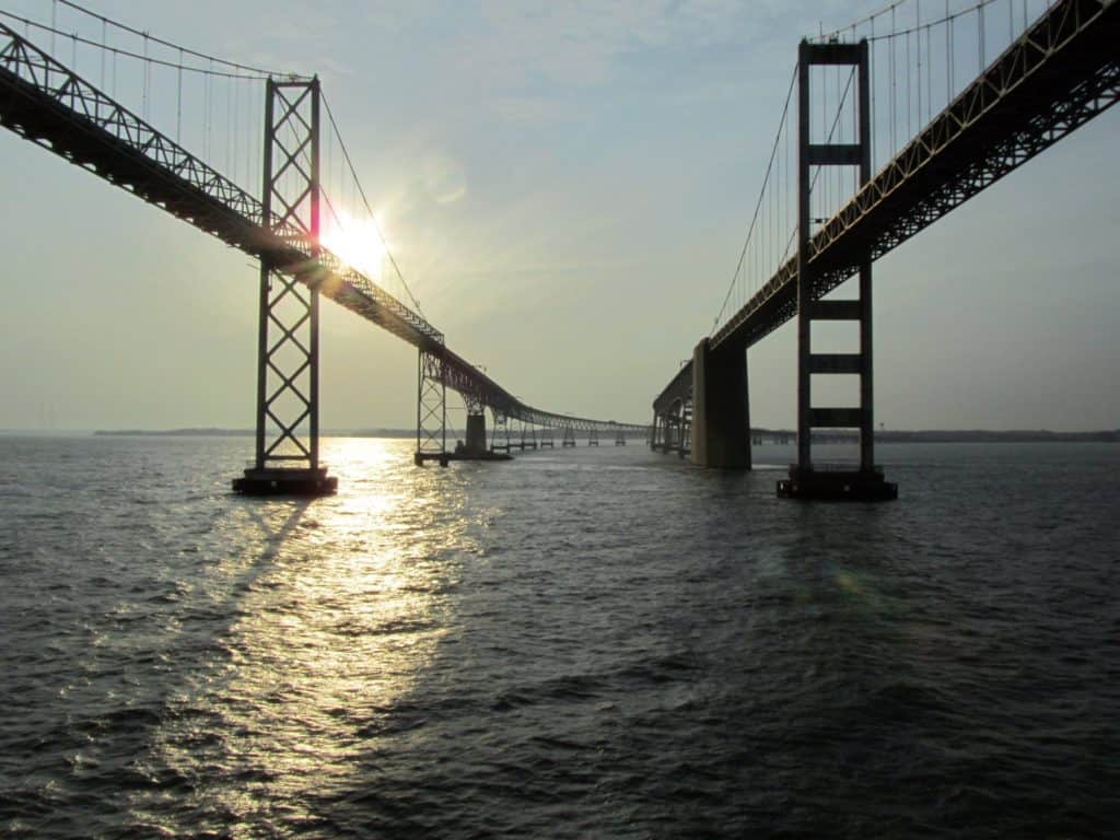 The sun peeks over the trusswork of the Chesapeake Bay Bridge. The Chesapeake Bay Bridge is one of the highest bridges in the US.