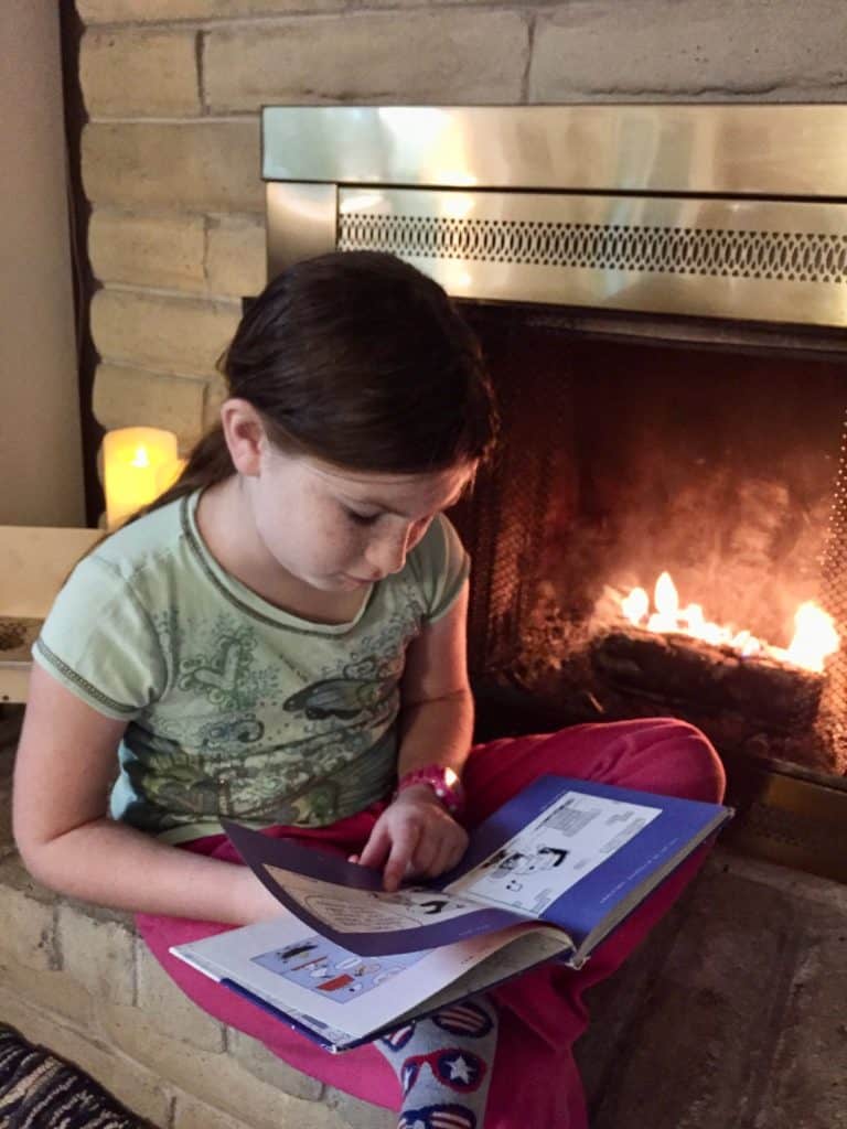 Girl reading a book. Science fiction books for 5th graders.