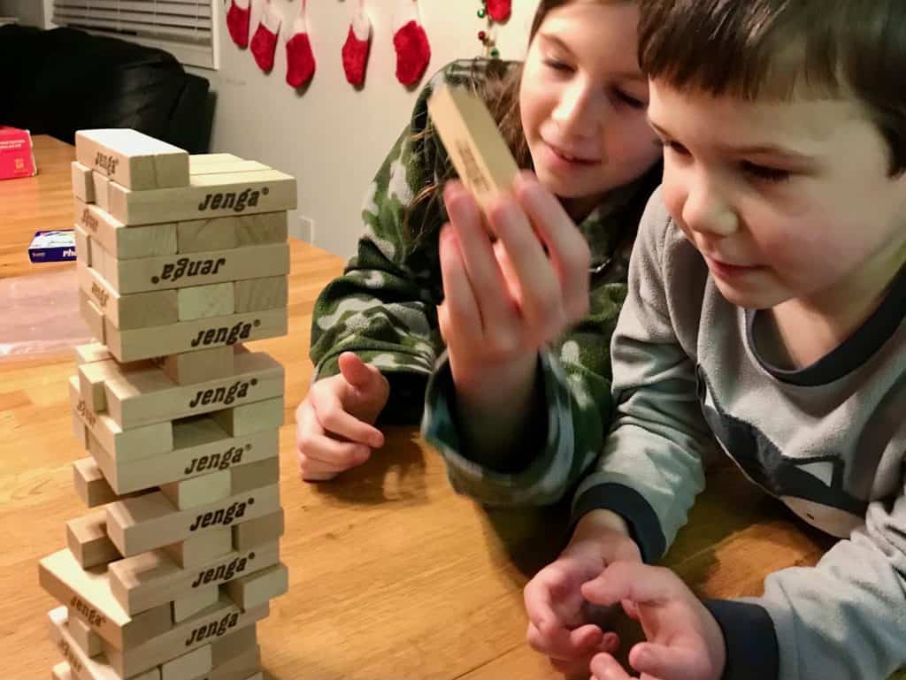 Kids playing Jenga game.