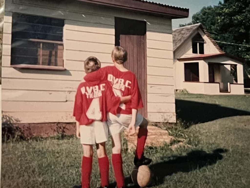 View from behind of boys in red and white soccer uniforms. Reasons why sexual assault survivors don't report abuse.