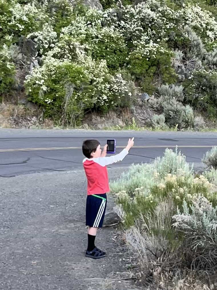 Boy taking photo with his Kindle Fire Tablet.