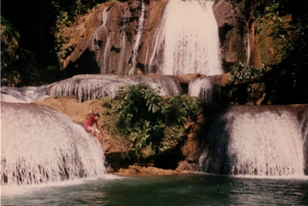 Me jumping off waterfalls in Jamaica.