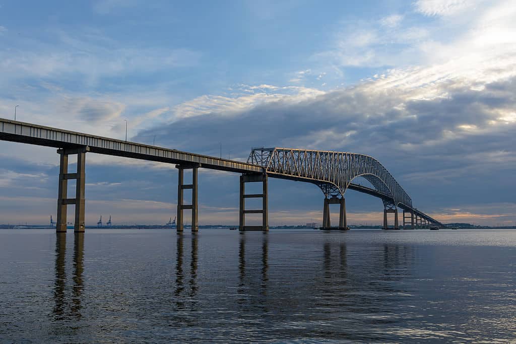 The Francis Scott Key Bridge rises high above the waters of Curtis Bay.