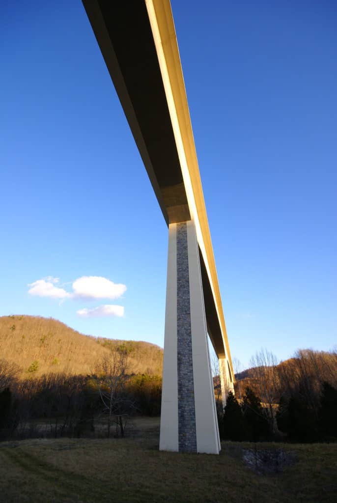 The Wilson Creek Bridge towers over the surrounding countryside. The Wilson Creek Bridge is one of the highest bridges in the US.