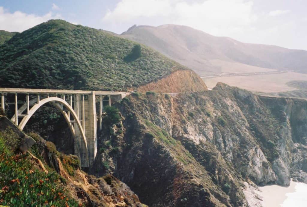 The Bixby Creek Bridge stands ready to receive travelers along the Big Sur stretch of the Pacific Coast Highway. 