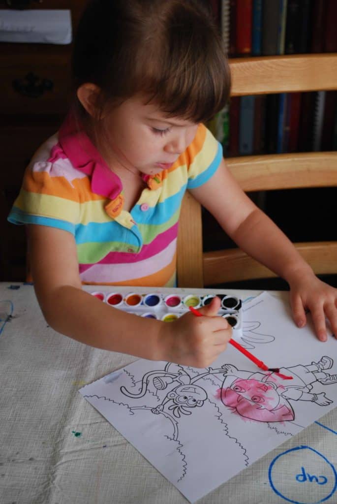 Girl painting with watercolors. How to start homeschooling today.