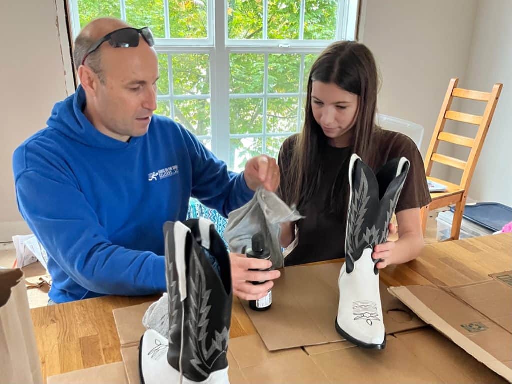 Dad and daughter cleaning boots. Repairing a Parenting mistake with teens.