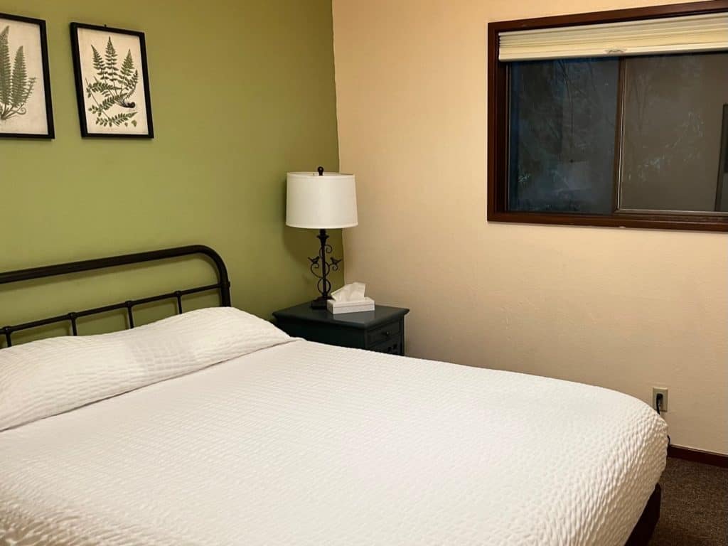 Hotel bedroom in calming colors.