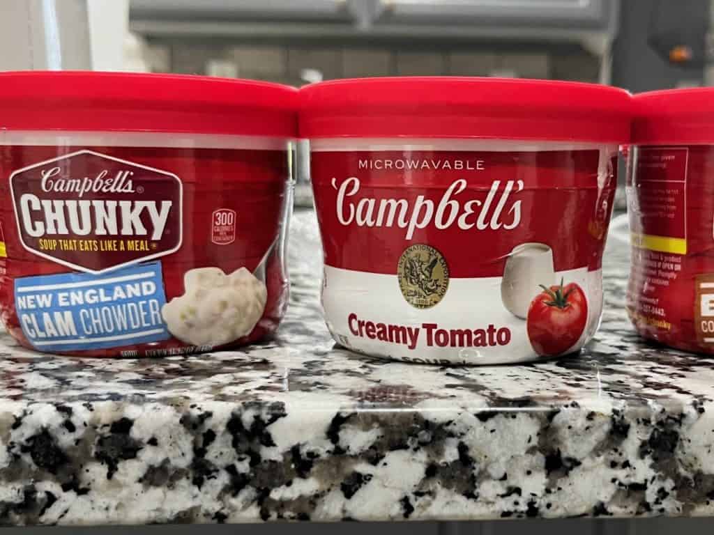 Individual Campbell's soup cups Creamy Tomato and New England Clam chowder. best canned foods for camping