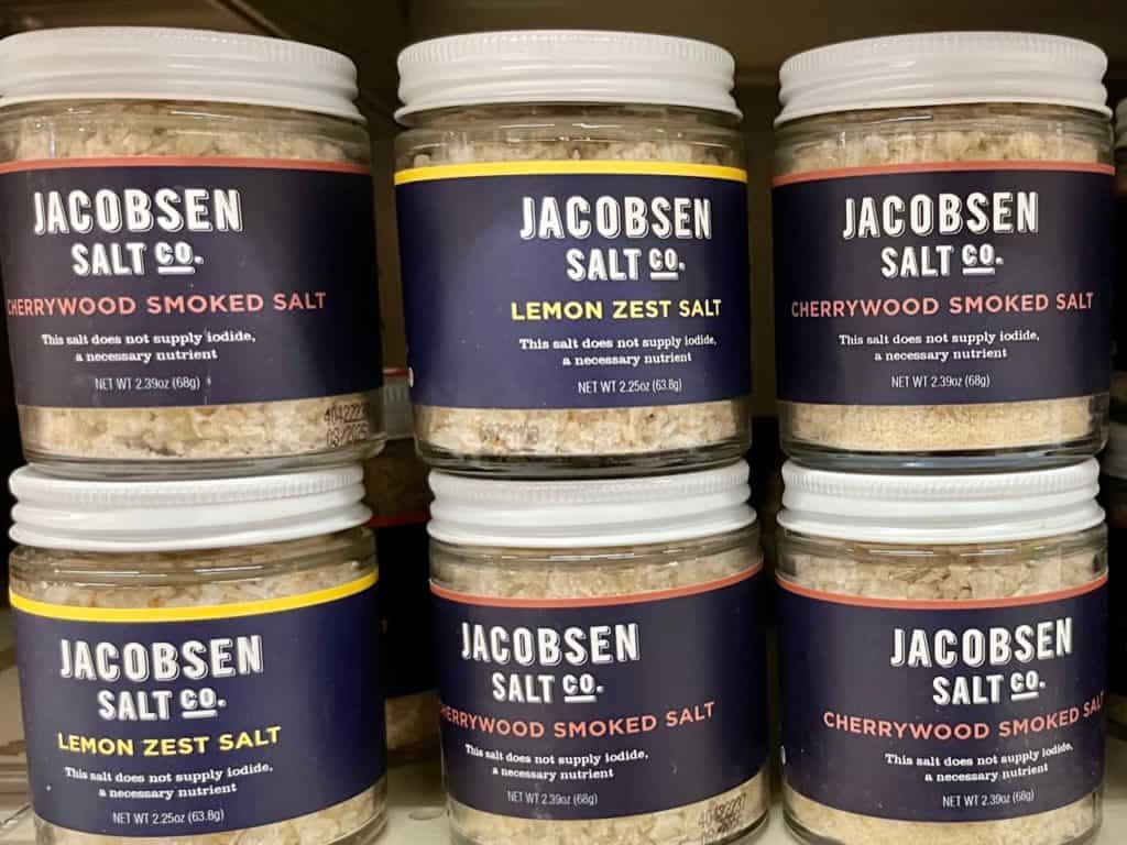 Jacobsen Salt Co. jars of Lemon Zest salt and Cherrywood Smoked Salt at a local grocery store.