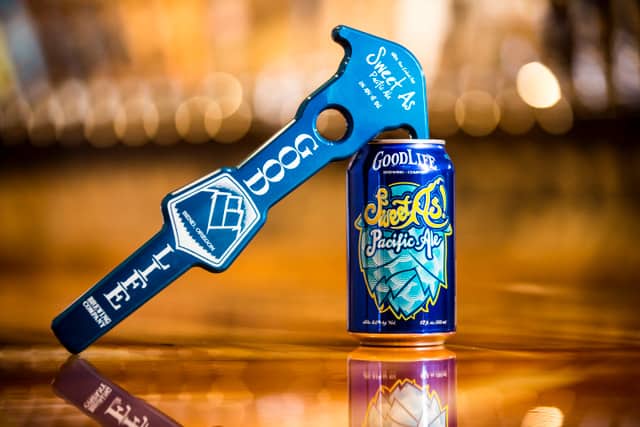 Image show the tap handle and can of GoodLife's SweetAs Pacific Ale.