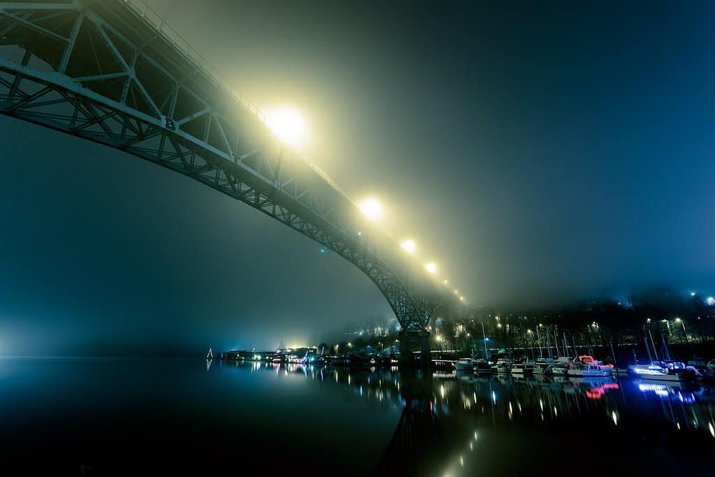 The Aurora Bridge lights up a foggy night in Seattle, Washington.