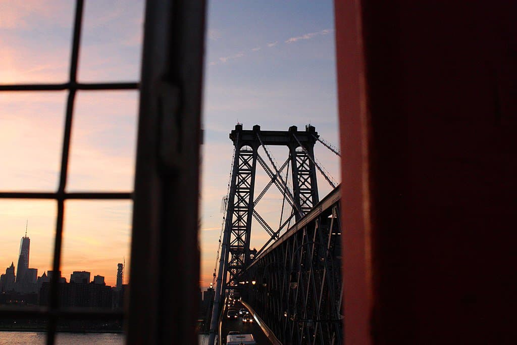 A New York sunset silhouettes the Williamsburg Bridge.