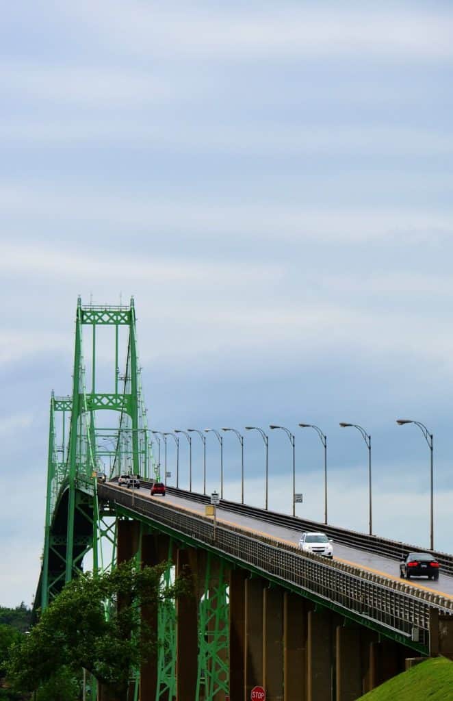 Cars descend from the heights of the Thousand Island Bridge. The Thousand Island Bridge is one of the highest bridges in the US.