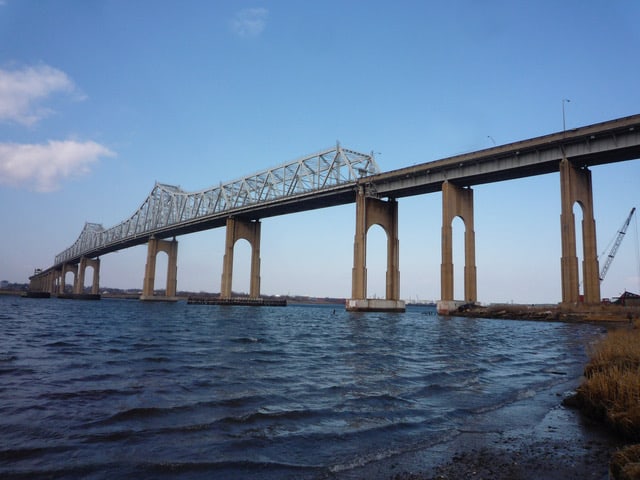 The Outerbridge Crossing stands high above the water.