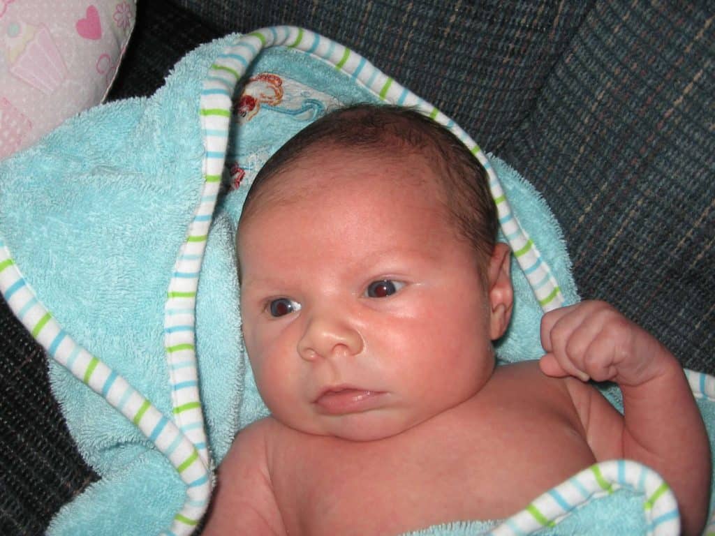 Baby in blue bath towel. Best baby registry ideas