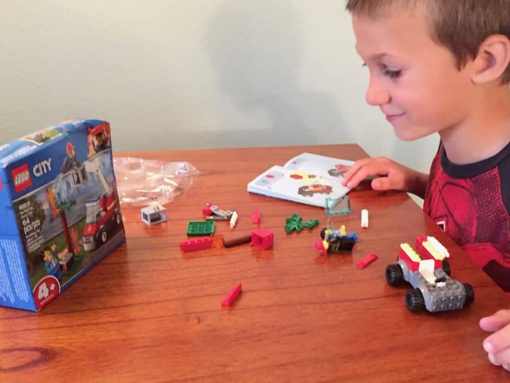 Boy working on Lego City set