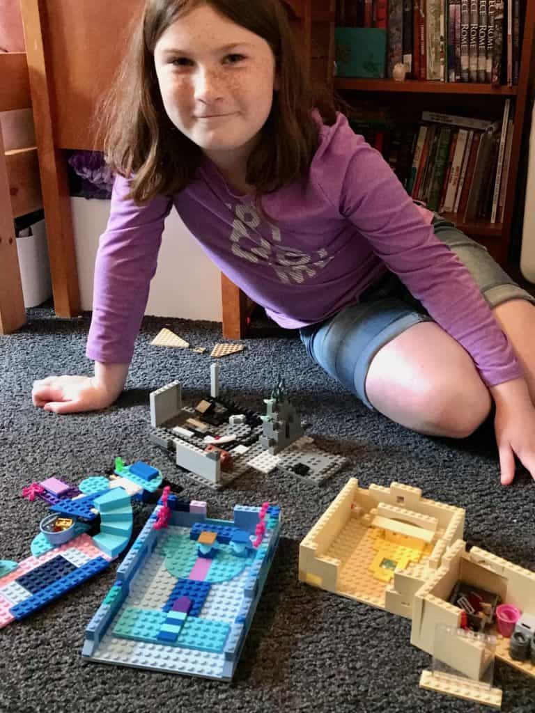 Girl with Lego creations 