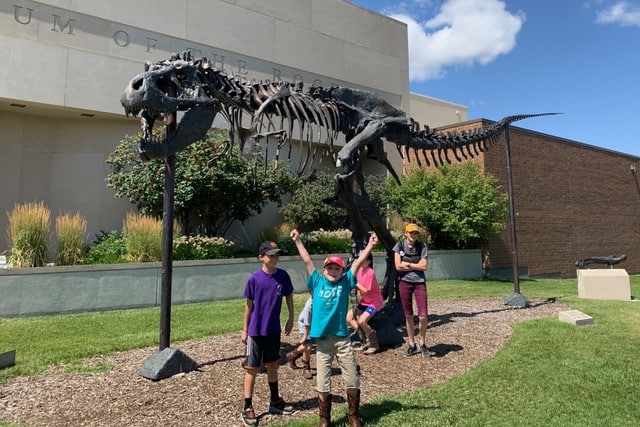 Our children post in front of Big Mike at the Museum of the Rockies. 