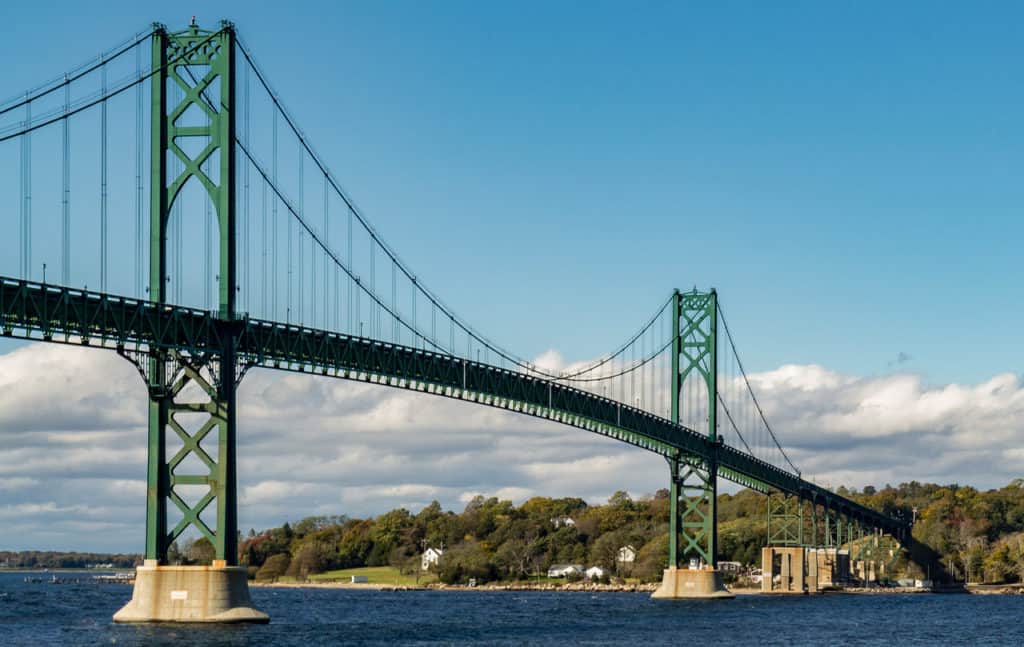 The Mount Hope Bridge stands boldly over the ocean waters below. Mount Hope Bridge is one of the highest bridges in the US.