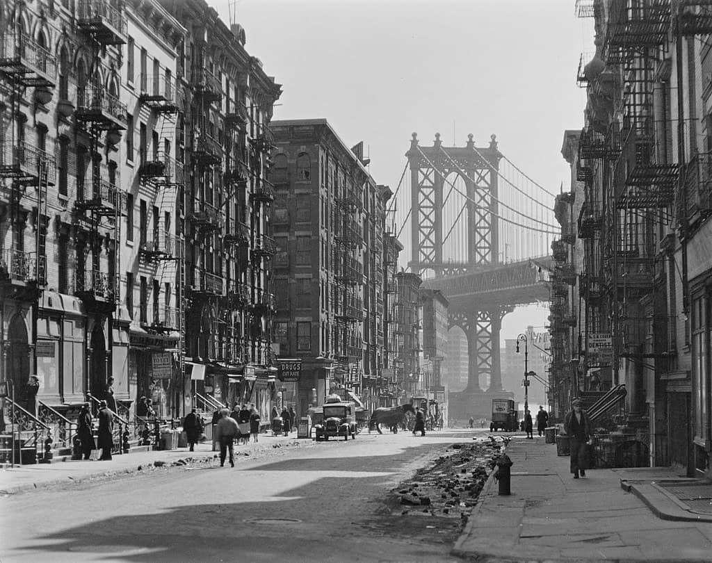 A historic, black and white photo shows Manhattan Bridge as seen from Dumbo.