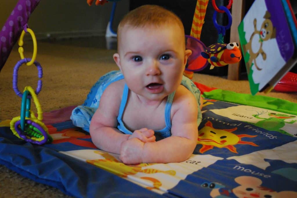 Baby on a play mat. Best baby registry ideas