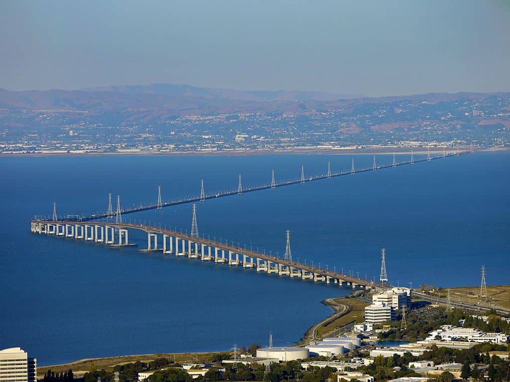 An aerial photo shows the extreme turn that's part of the San Mateo-Hayward Bridge. The San Mateo-Hayward Bridge is one of the highest bridges in the US.