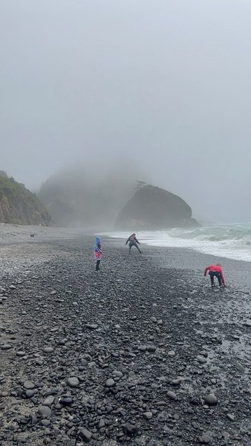 Three of my children search for agates and other gems at Short Beach. Short Beach is one of the best things to do with kids on the Oregon Coast.