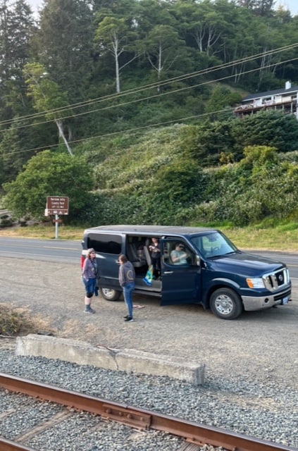 Our family hangs out by the car about ten feet from the nearby railroad track. 