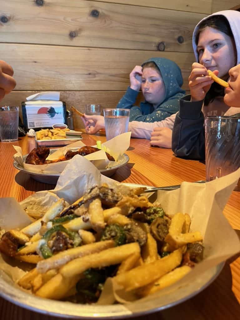 Our daughters enjoy Dirty Fries and other delicious appetizers at Public Coast Brewing Company.