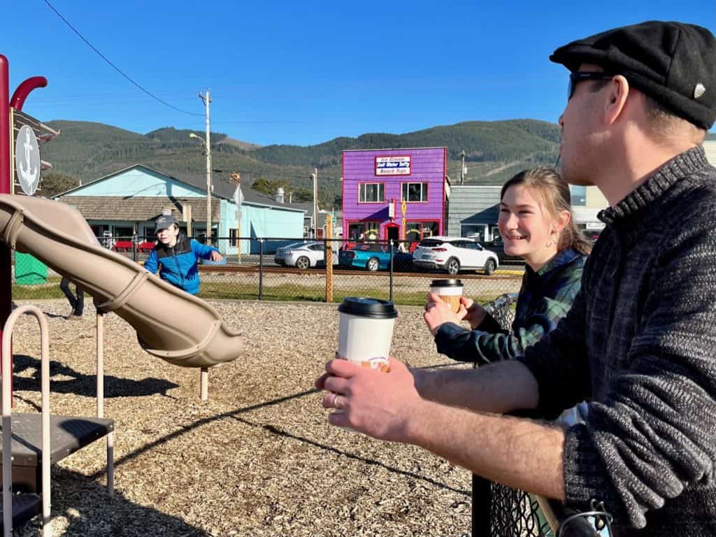 Dad and daughter having coffee at the Pirate park. Things to do in Rockaway Beach Oregon.