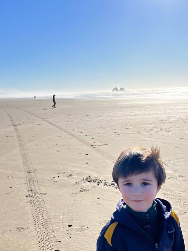 Boy at Rockaway Beach, Oregon. Things to do in Rockaway Beach Oregon.