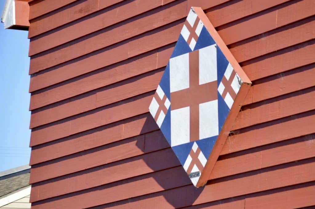 Wooden quilt square on Red barn.