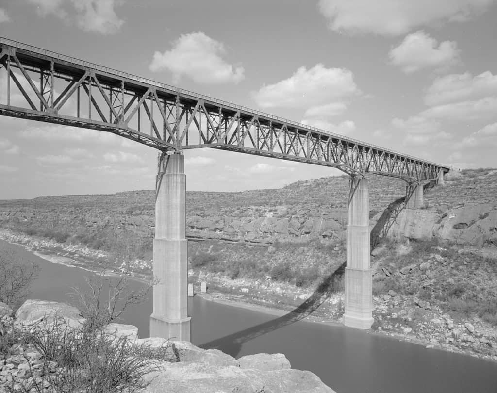 The Pecos River High Bridge stands tall over the Pecos River. The Pecos River High Bridge is one of the highest bridges in the US.
