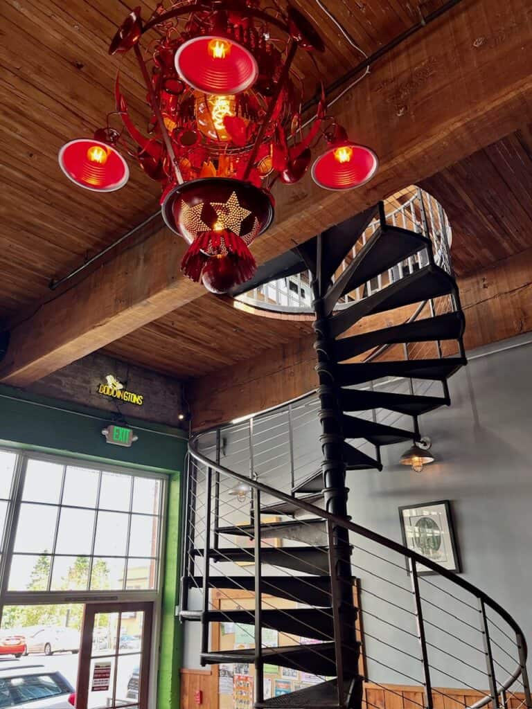 Spiral staircase and beautiful lighting inside the Fort George Brewery. 