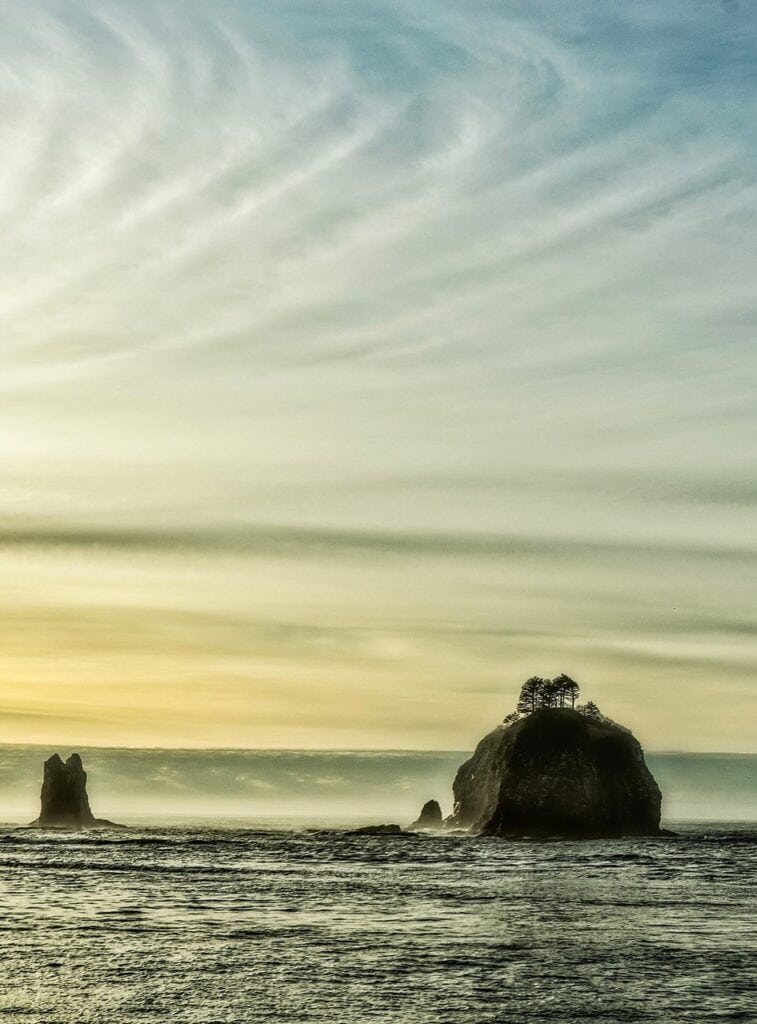 Dusk sets in at Ruby Beach of Olympic National Park. Olympic National Park is one of the best national parks to visit in November and December.
