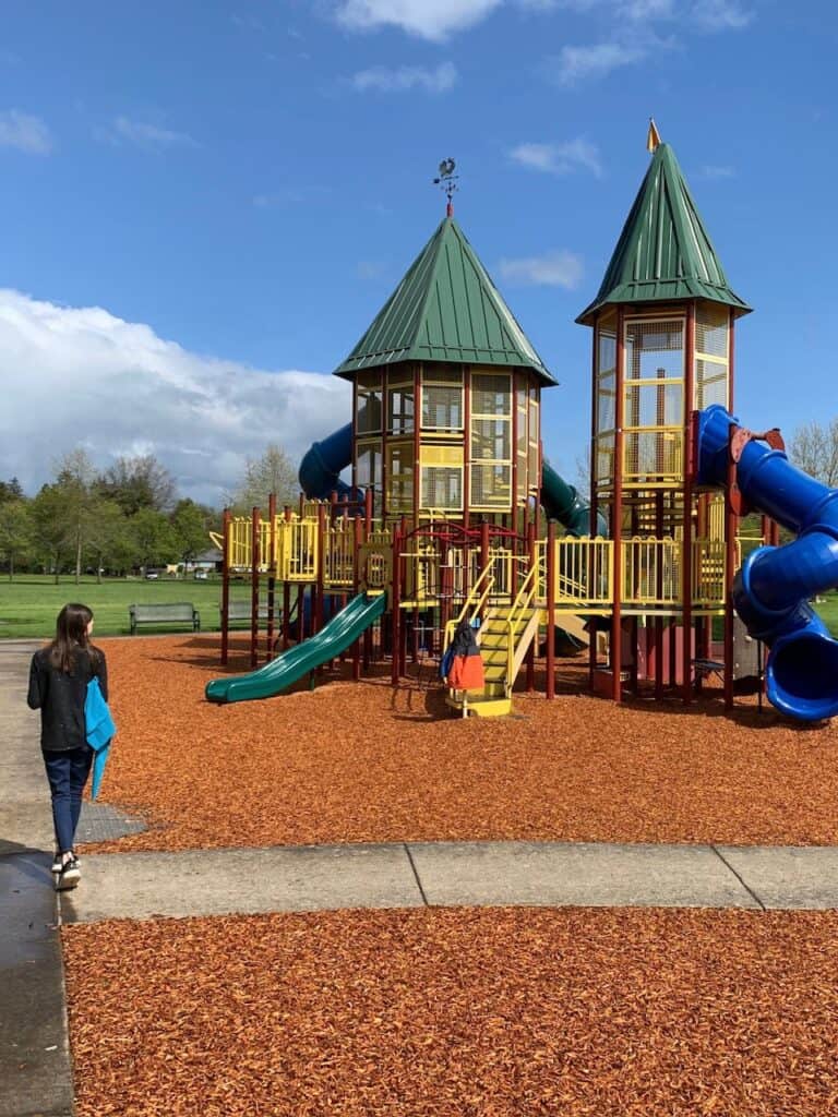 Girl walking to Discovery Meadows playground in McMinnville.