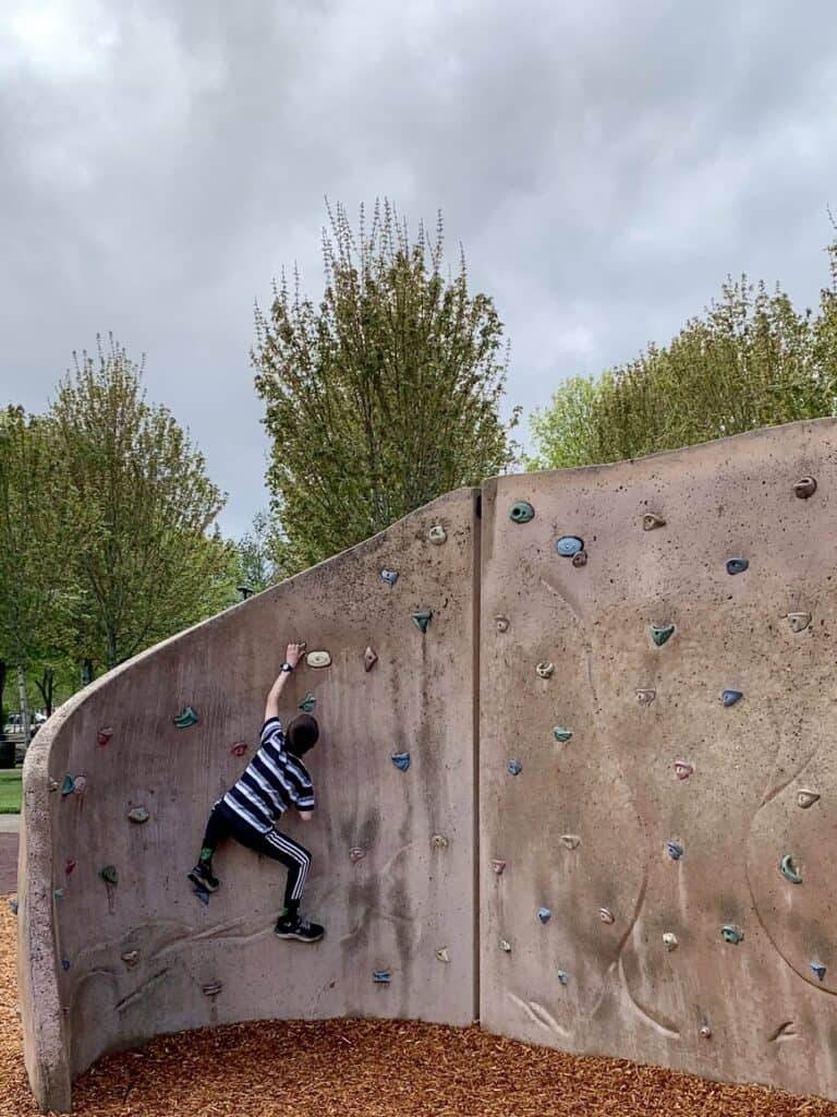 Our son climbing part of the large climbing wall at Discovery Meadows.