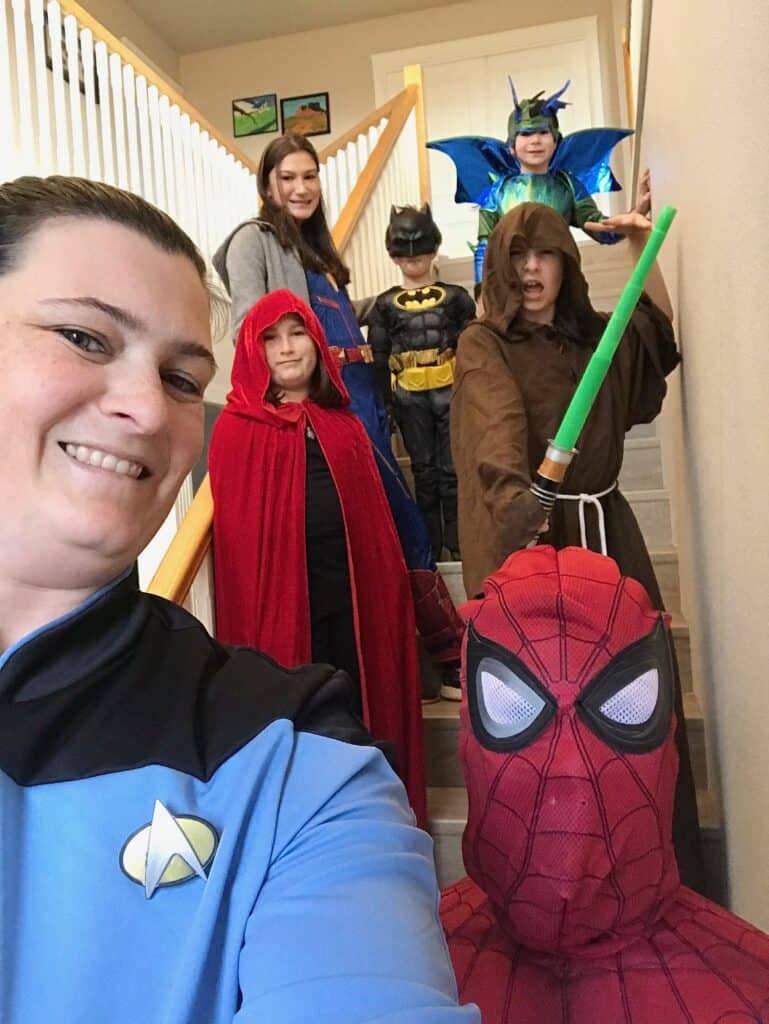 Our family (except Brian) on the staircase in our Halloween costumes. Halloween activities for teens.