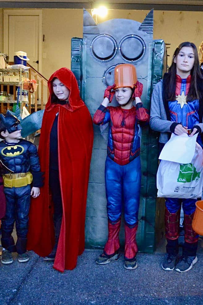 Our kids in costume with the giant homemade centipede costume at the back. Halloween activities for teens