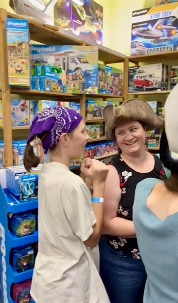 Jenn and daughter trying on a tricorn hat.