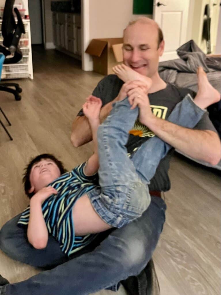 Brian and son enjoying a tickle fest.